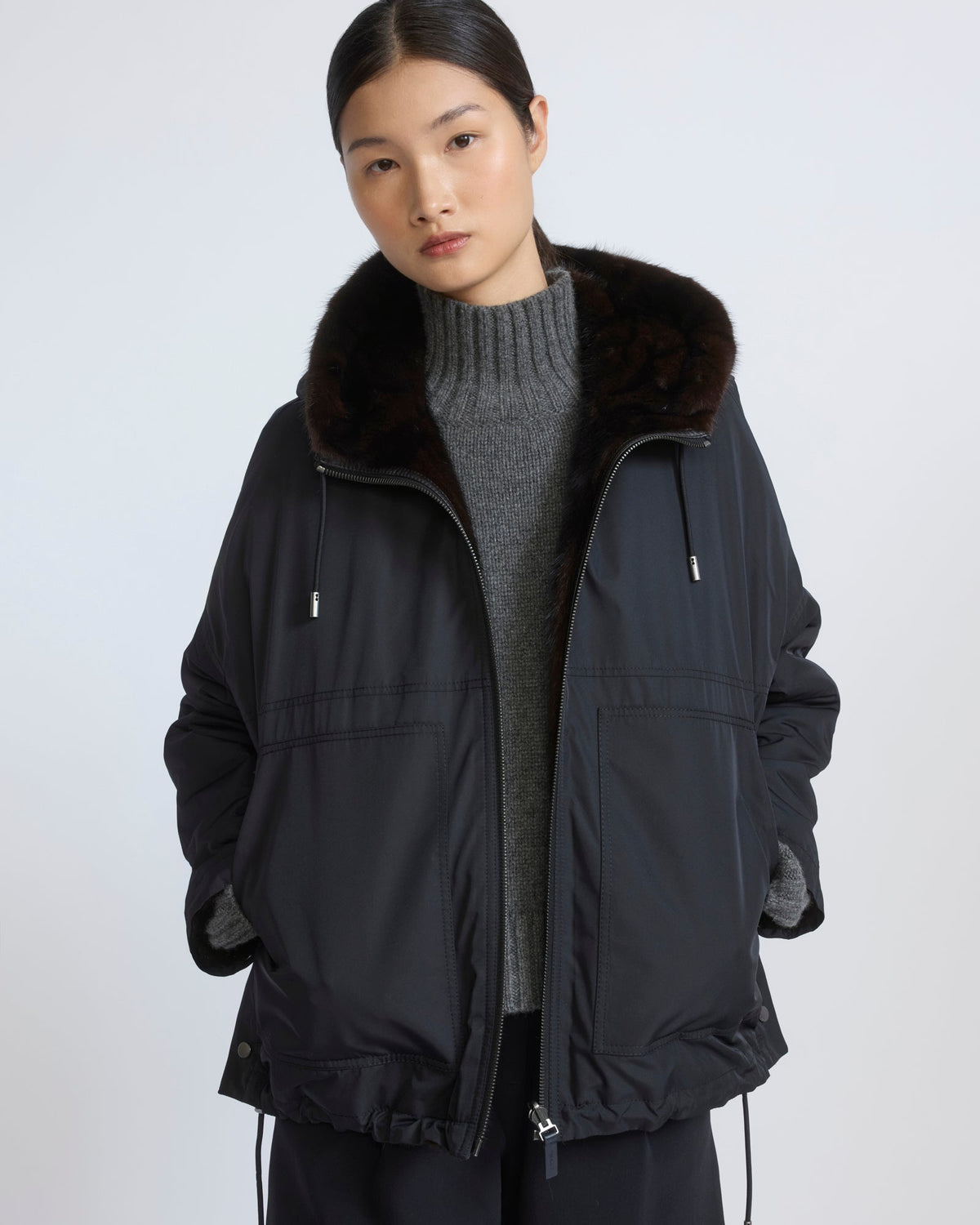 Short reversible water-repellent technical fabric jacket with mink fur