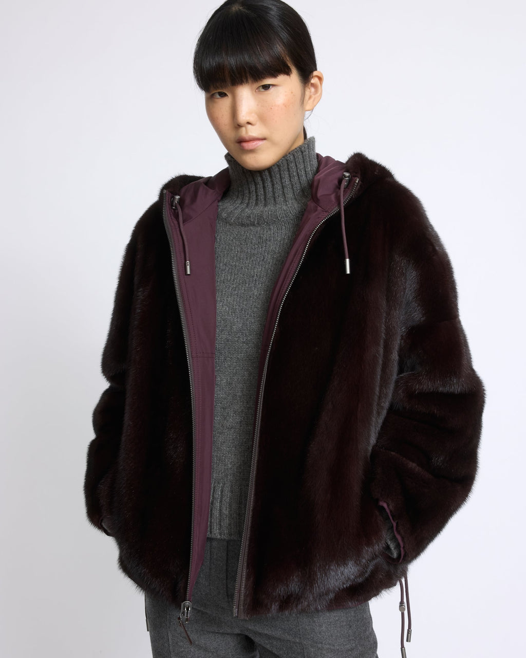 Short reversible water-repellent technical fabric jacket with mink fur