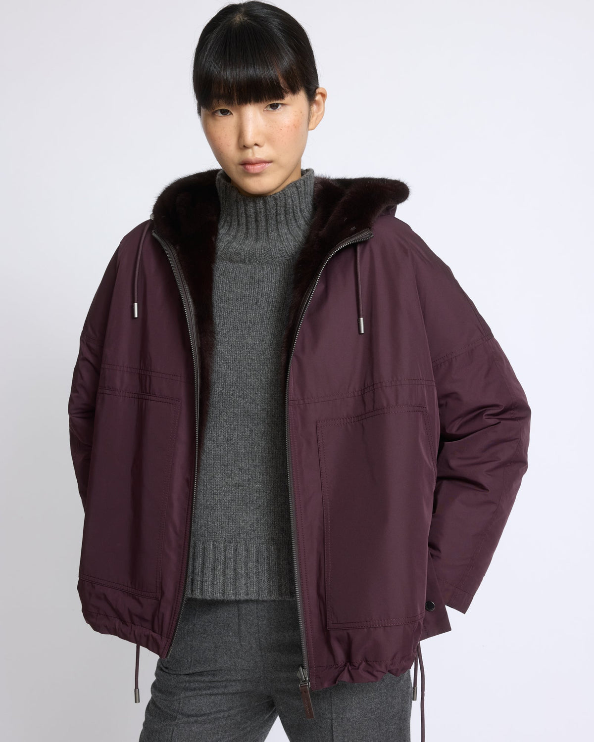 Short reversible water-repellent technical fabric jacket with mink fur