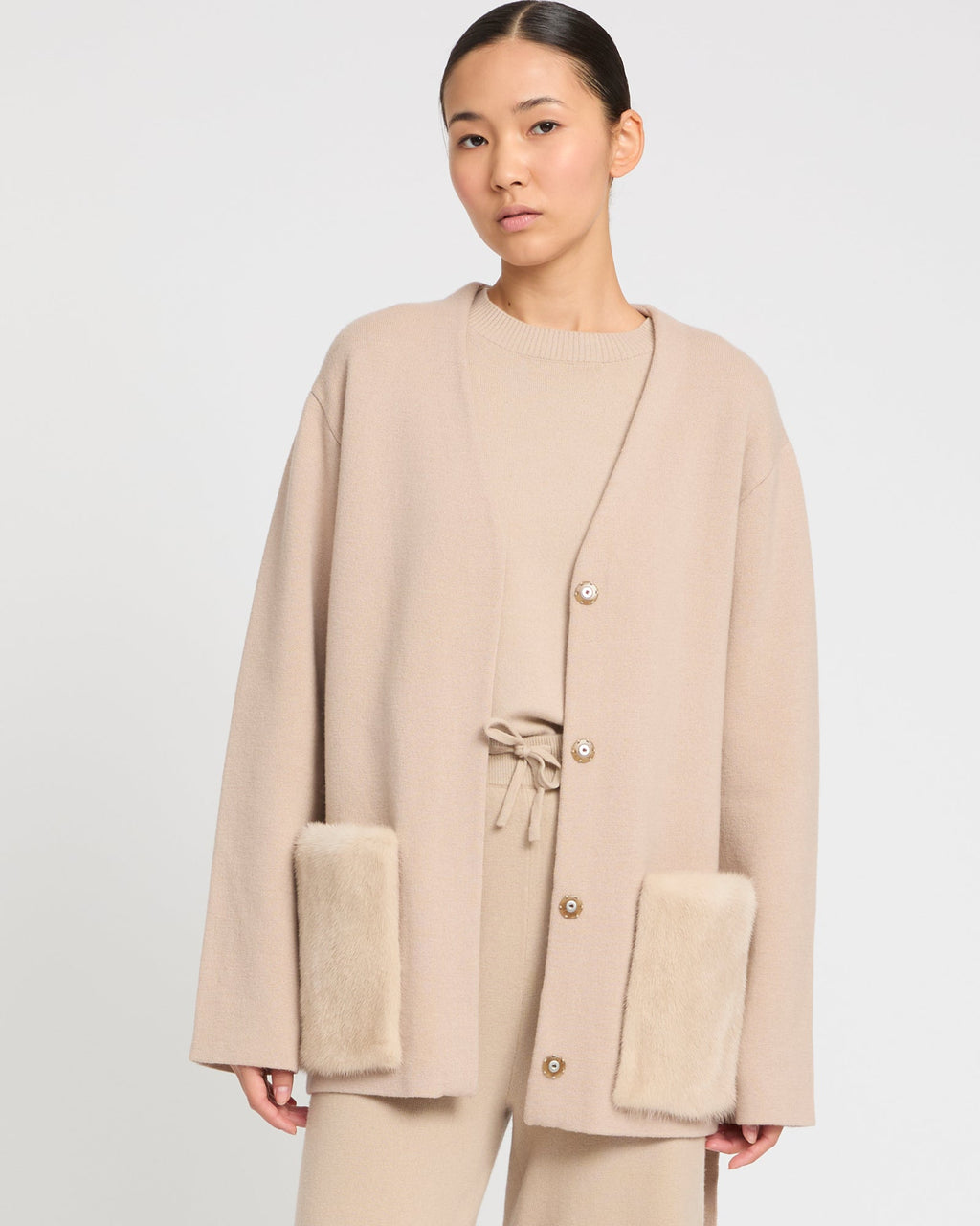 Belted knit and mink jacket