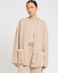 Belted knit and mink jacket