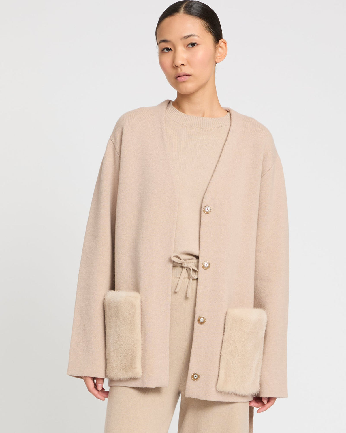 Belted knit and mink jacket