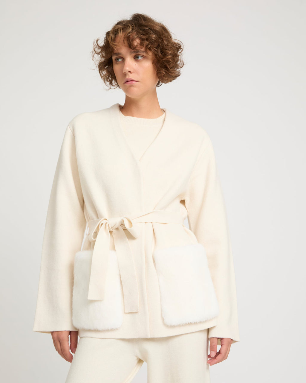Belted knit and mink jacket