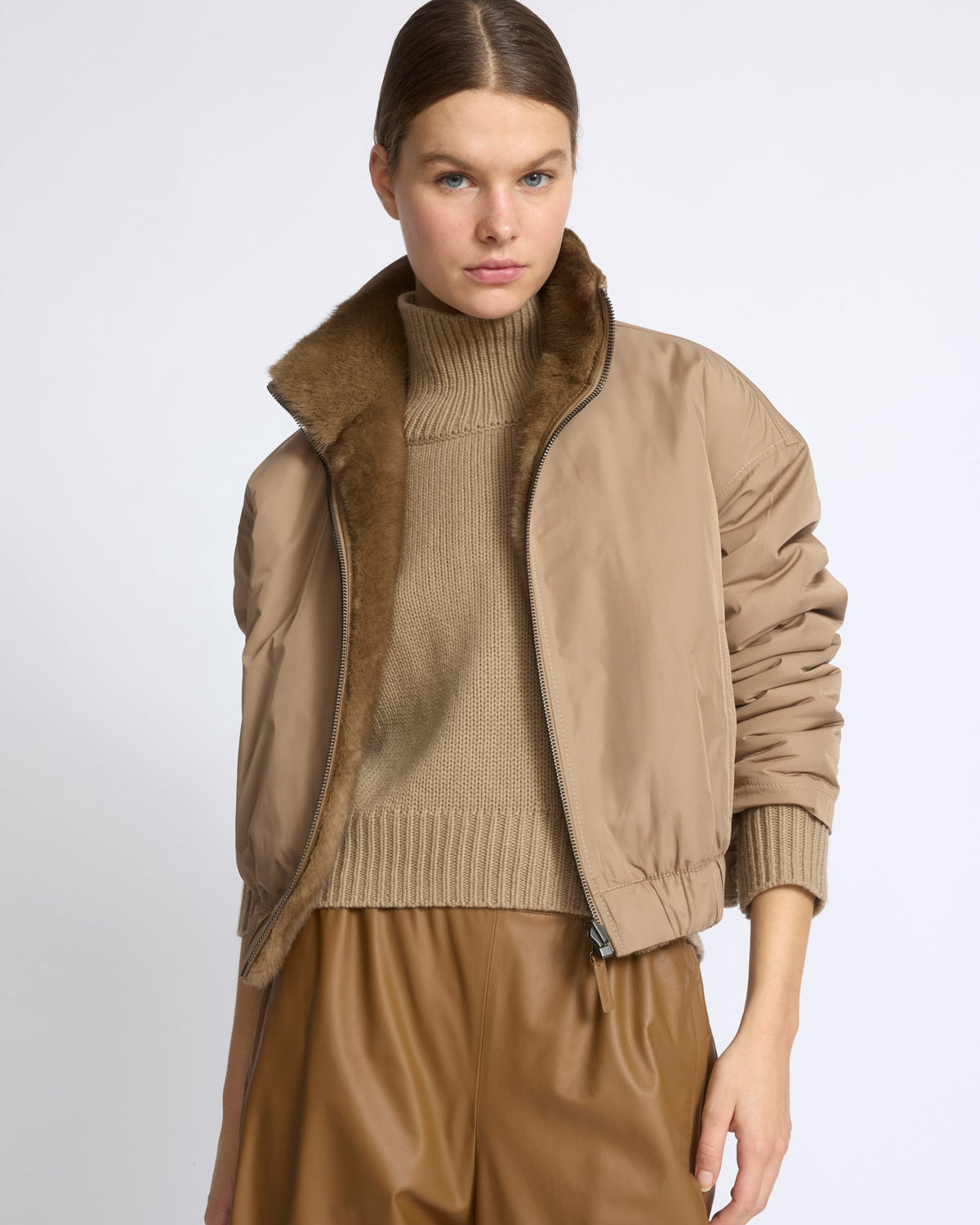 Reversible water-repellent technical fabric jacket with mink fur