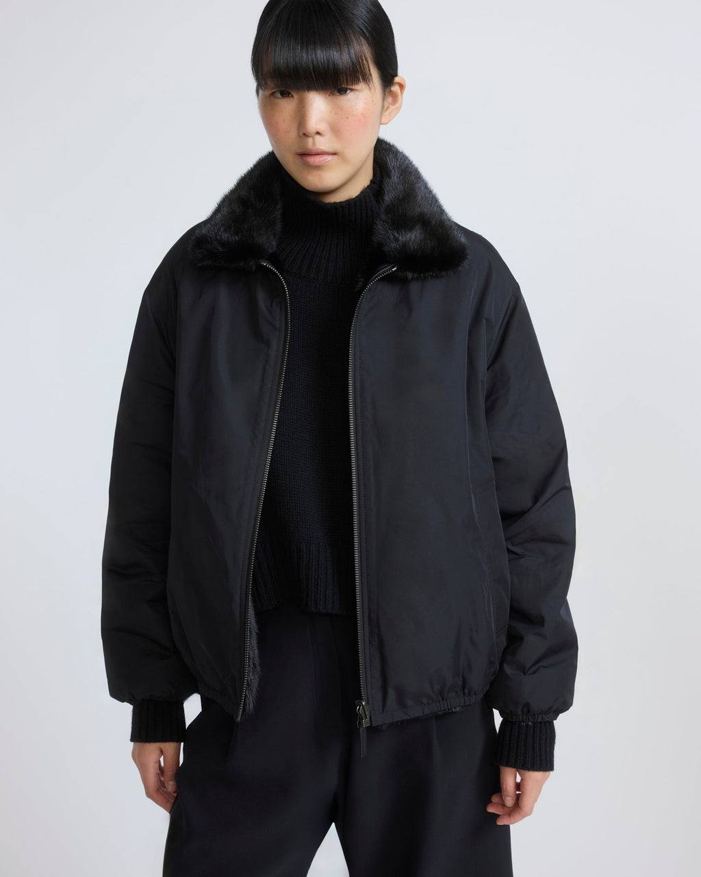 Reversible water-repellent technical fabric bomber with mink fur