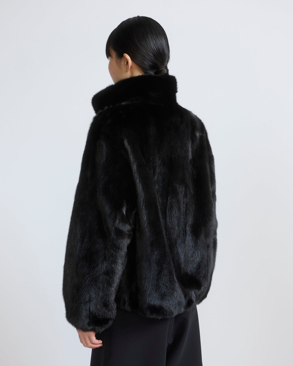 Reversible water-repellent technical fabric bomber with mink fur
