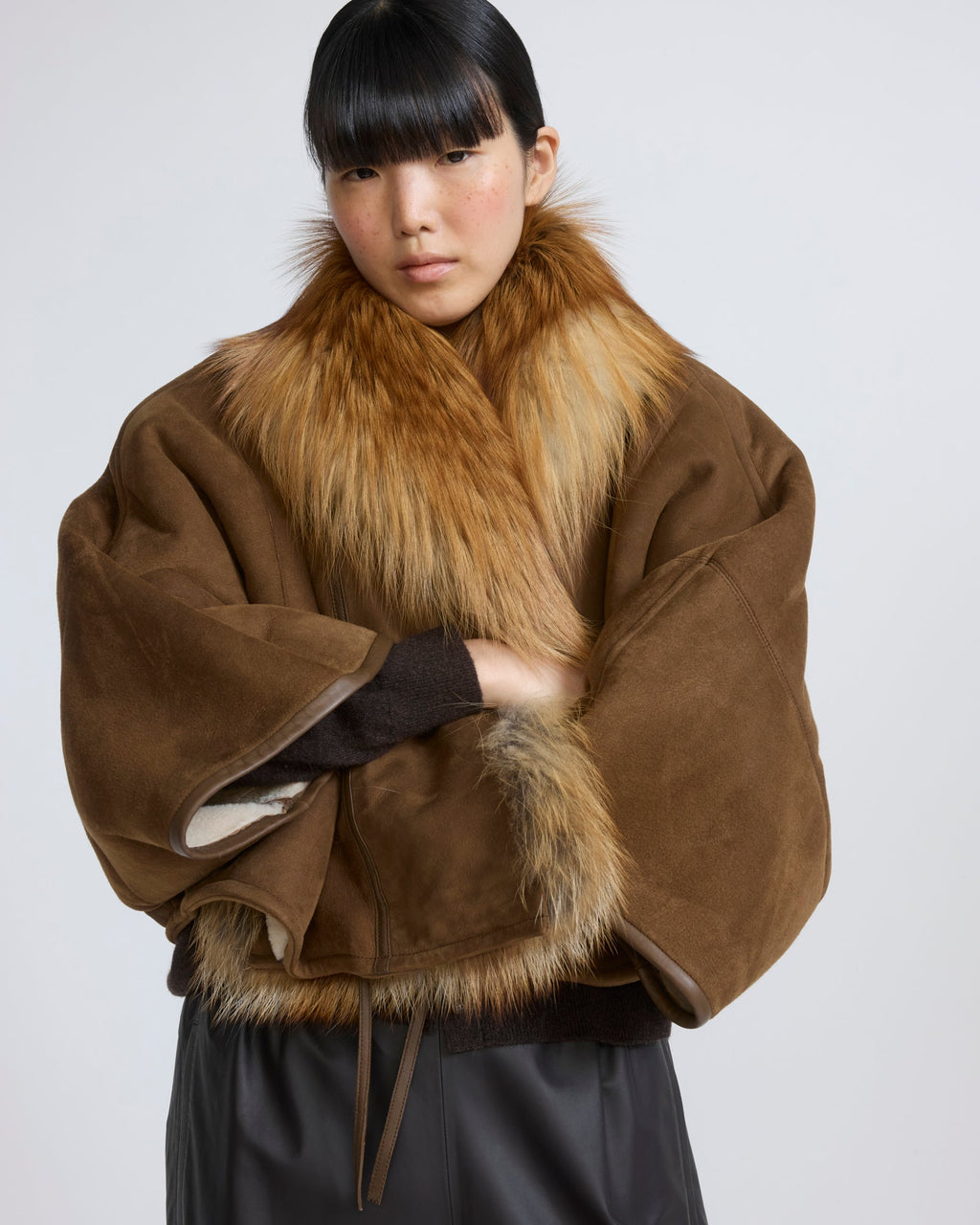 Lambskin shearling cape with fox fur collar