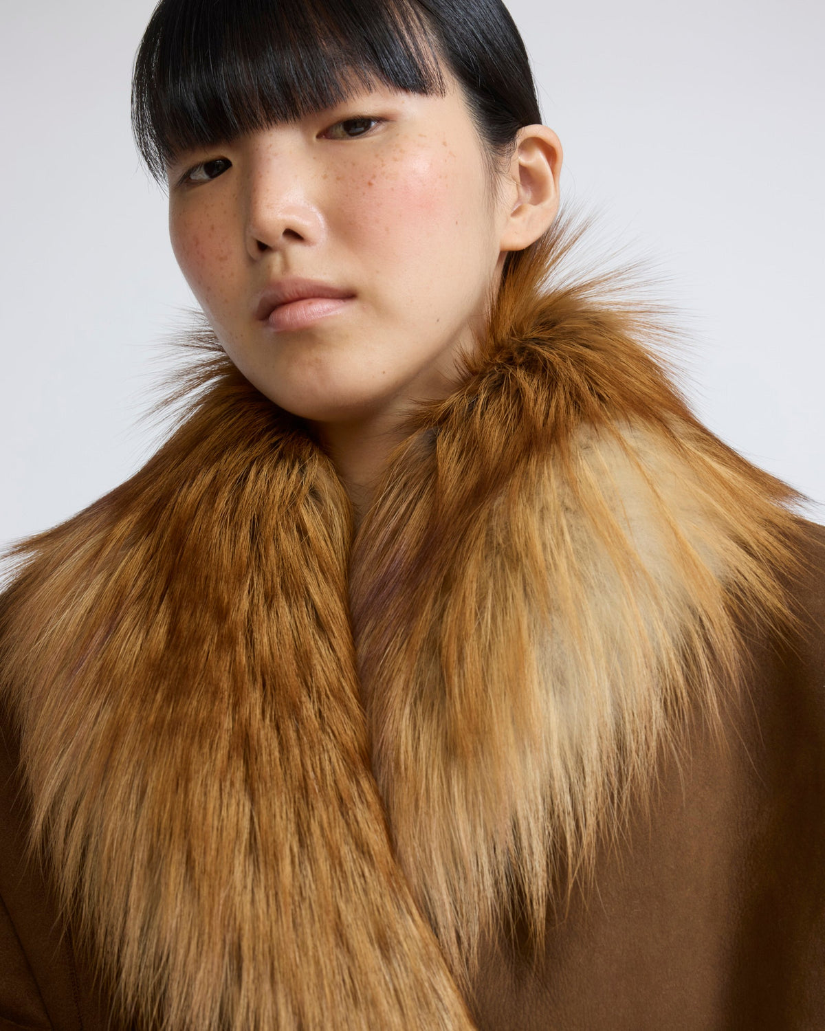 Lambskin shearling cape with fox fur collar
