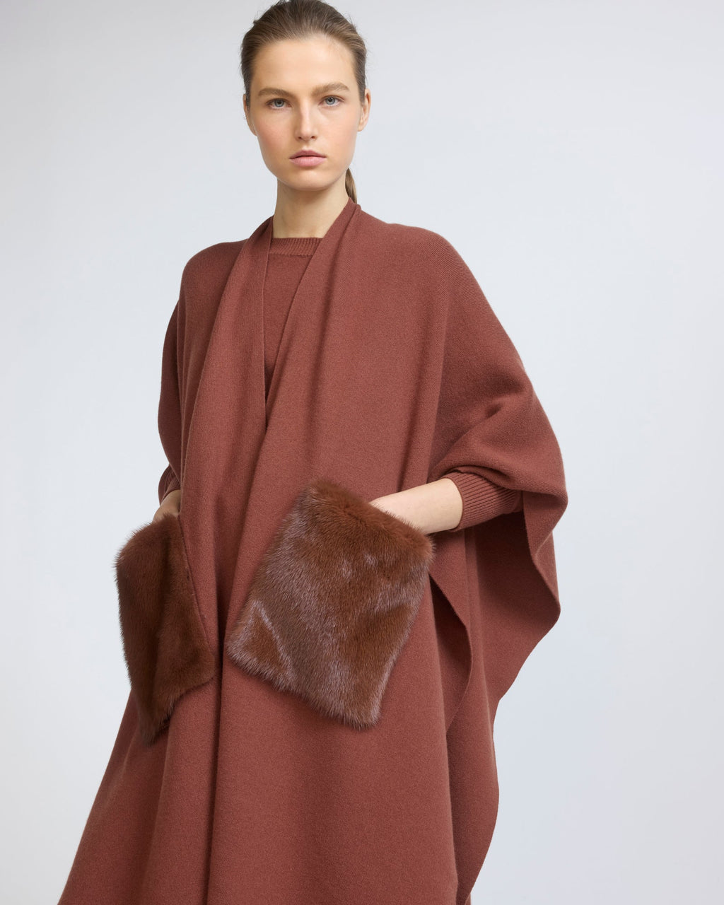 Merino knit poncho with mink fur