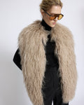 Merino knit gilet with curly long-haired lambskin