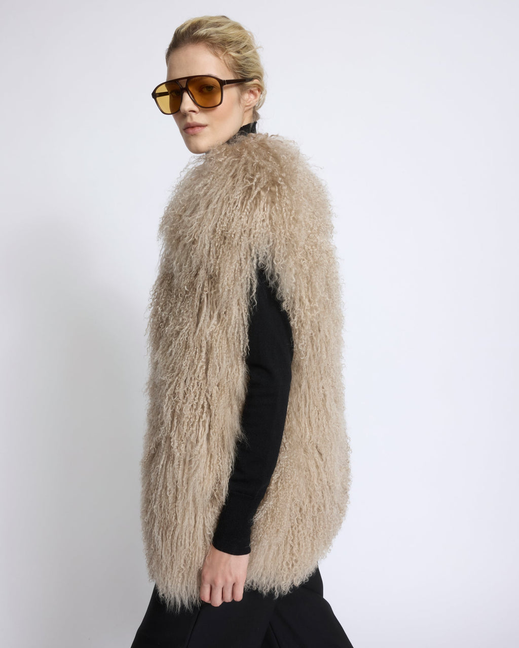 Merino knit gilet with curly long-haired lambskin