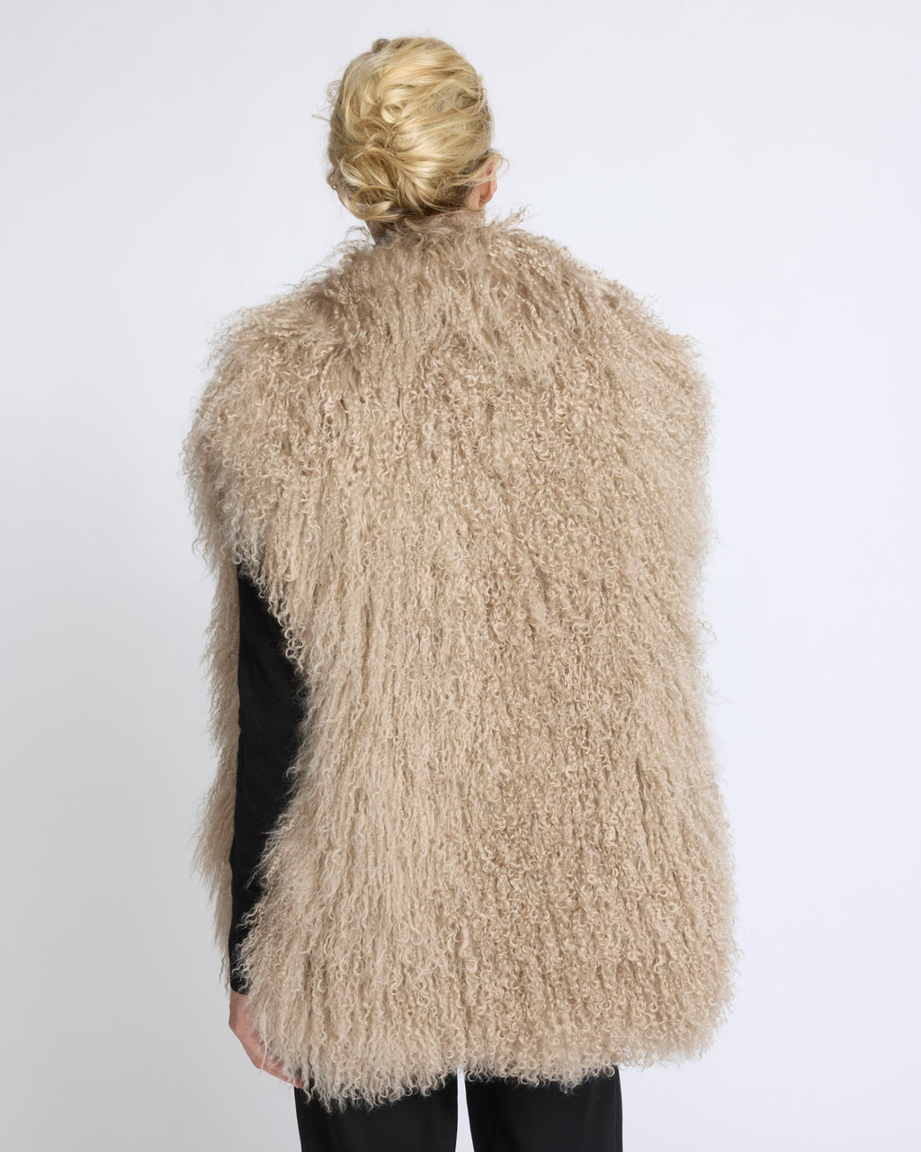 Merino knit gilet with curly long-haired lambskin